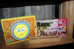 lot 154 image: Sponge Bob Dominoes & Bingo and Puzzle, and Pick up Sticks Game, Dora Domioes