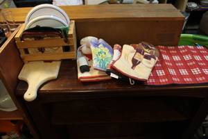 lot 101 image: Pot holders wood cutting board drying mat and more see pictures