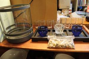 lot 105 image: Wood candle holder with glass candle holders and rocks large round glass candle holder and eight shot glasses for short for tall