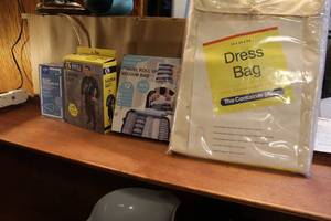 lot 109 image: Mixed lot blood pressure kit sauna suit travel roll up vacuum bags and a dress bag