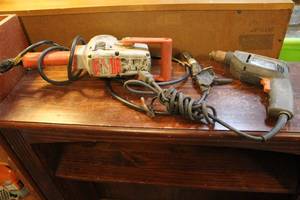 lot 118 image: Electric Milwaukee hammer drill cord not the best shap  Black & decker drill