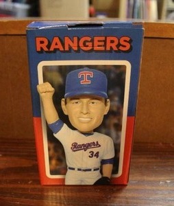 lot 155 image: Nolan Ryans bobblehead hand is broken but pice is there and can be glued
