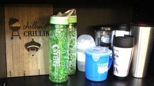 lot 170 image: Chilling and grilling bottle opener and hooks on it and a mix of cups
