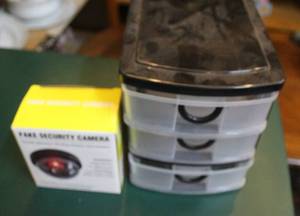 lot 174 image: Fake security camera and a small three drawer container