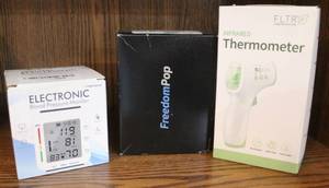 lot 219 image: Electronic blood pressure monitorFreedomPopInfrared thermometer