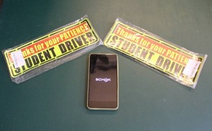lot 228 image: Student driver magnets and cell phone