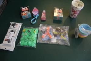lot 232 image: Mixed lot lets mingle card games cups silicone cupcake holders and glow in the dark rocks I did that stickers and more see pictures