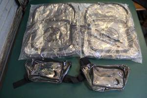 lot 235 image: 2 see-through Mavericks backpack and two fanny packs see through