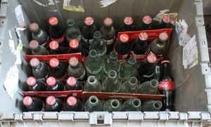 lot 263 image: vintage coke bottles some empty some full