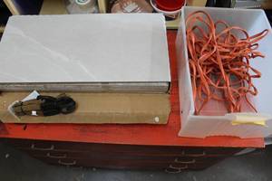 lot 307 image: glazed porcelain floor tile 12-in x 24-in x 516-in 9 pieces  extension cord and plug and straps