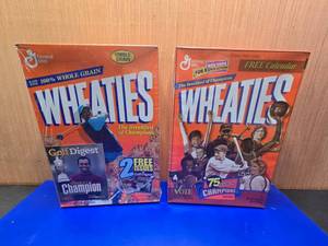 lot 18 image: 2 Boxes of Sealed Wheaties.  Tiger Woods &  75 Years of Champions.