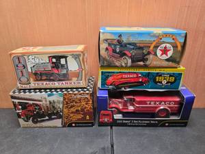 lot 64 image: Lot of 5 TexacoErtl Diecast Coin Banks