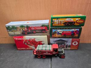 lot 65 image: Lot of 6 TexacoErtl Diecast Coin Banks