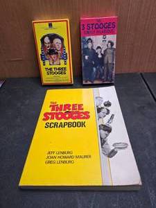 lot 66 image: Lot of Three Stooges Items.  2 VHS Tapes & Scrapbook