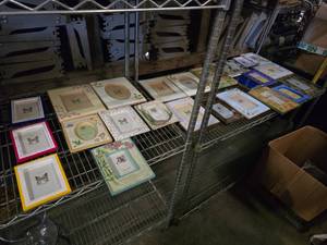 lot 108 image: Contents of Shelf.  MASSIVE Lot of Picture Frames.  Includes Everything on Middle Shelf.