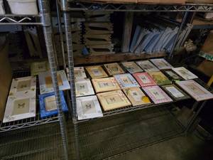lot 109 image: Contents of Shelf.  MASSIVE Lot of Picture Frames.  Includes Everything on Middle Shelf.