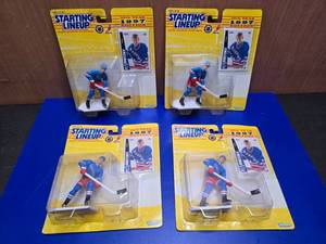 lot 319 image: Lot of 4 1997 Starting Lineup Wayne Gretzky NHL Figures On Card