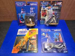 lot 330 image: Lot of 4 Starting Lineup Ken Griffey Jr MLB Figures On Card.