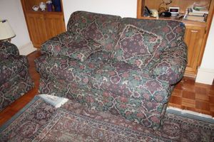 lot 46 image: Green and burgundy loveseat sofa by Clayton Marcus