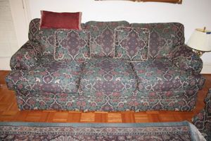 lot 47 image: Green and burgundy couch sofa by Clayton Marcus