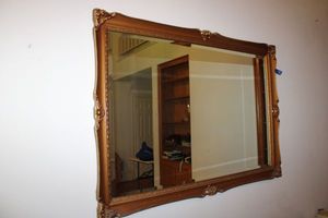 lot 52 image: Gold framed beveled wall mirror