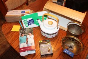 lot 87 image: Misc. lot bread box, brass bowl, metal teapot, Life protect Belle unit, and brown lunch bags