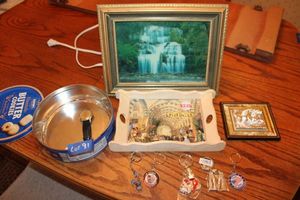 lot 91 image: Sleep sound maker with motion waterfall photo, key chains, and vintage watch
