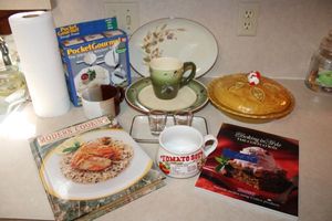 lot 95 image: Cookbooks, pie plate, dishes and pocket gourmet