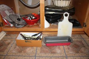 lot 97 image: Kitchen pans, flatware, splatter screens, and more
