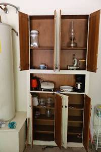 lot 131 image: Hurricane lamp, vintage meat grinder, Foreman grill, skillet, locking lid jars