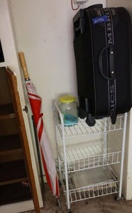 lot 132 image: Rolling suitcase Cambridge Classics, and rolling white wire storage cart