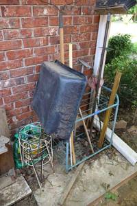 lot 158 image: Garden tool organizing stand, tools, and wire plant stands