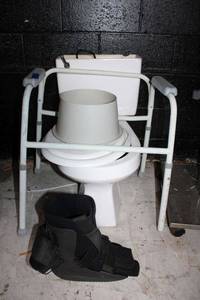 lot 200 image: Used toilet and portable potty seat plus med boot