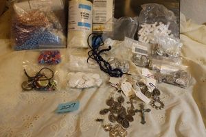 lot 227 image: Jewelry making Catholic saint pendants, threads, beads