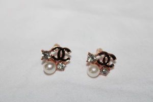 lot 305 image: Enamel fashion jewelry CC Chanel rose gold earrings