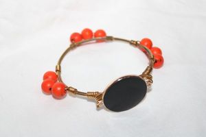 lot 314 image: Enamel fashion jewelry orange and black bracelet