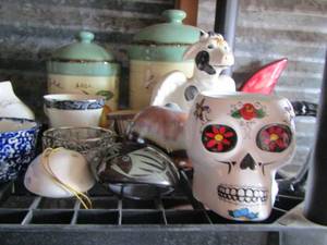 lot 63 image: Cannisters, skull, and cows plus