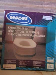 lot 77 image: Invacare Raised toilet seat in box