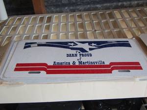 lot 104 image: Born Proud license plates x 5