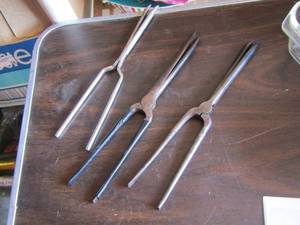lot 130 image: Antique curling irons x 3