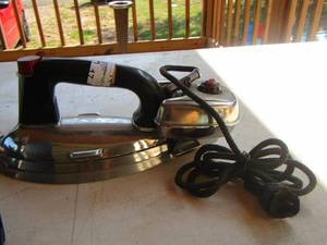 lot 17 image: cast iron with handles has outlet cord and gassteam canister general mills
