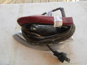 lot 18 image: cast iron with handles has outlet cord no markings