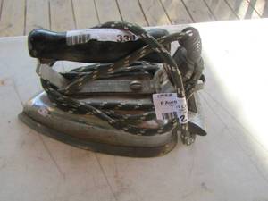 lot 21 image: metal iron with handle and power cable manning & bowman USA