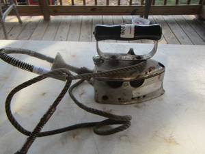 lot 147 image: cast iron with handle has gas line cord no markings