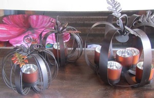 lot 178 image: Metal pumpkin candle holders
