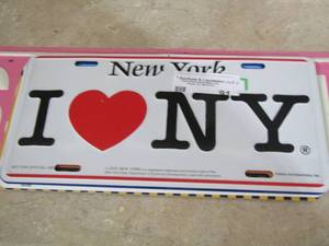 lot 91 image: License plates from New York- princess parking metal sign