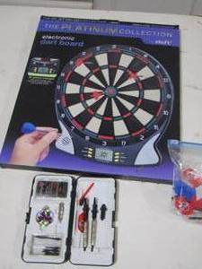 lot 134 image: electronic dart board with multiple pairs of darts