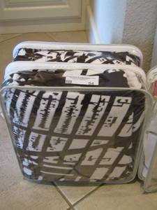 lot 54 image: black and white blanket in bag