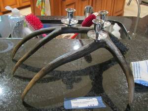 lot 157 image: Deer horns  (faux) made into candle stands for center table dcor