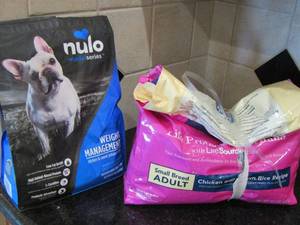 lot 45 image: 2 opened bags of dog food- Nulo brand